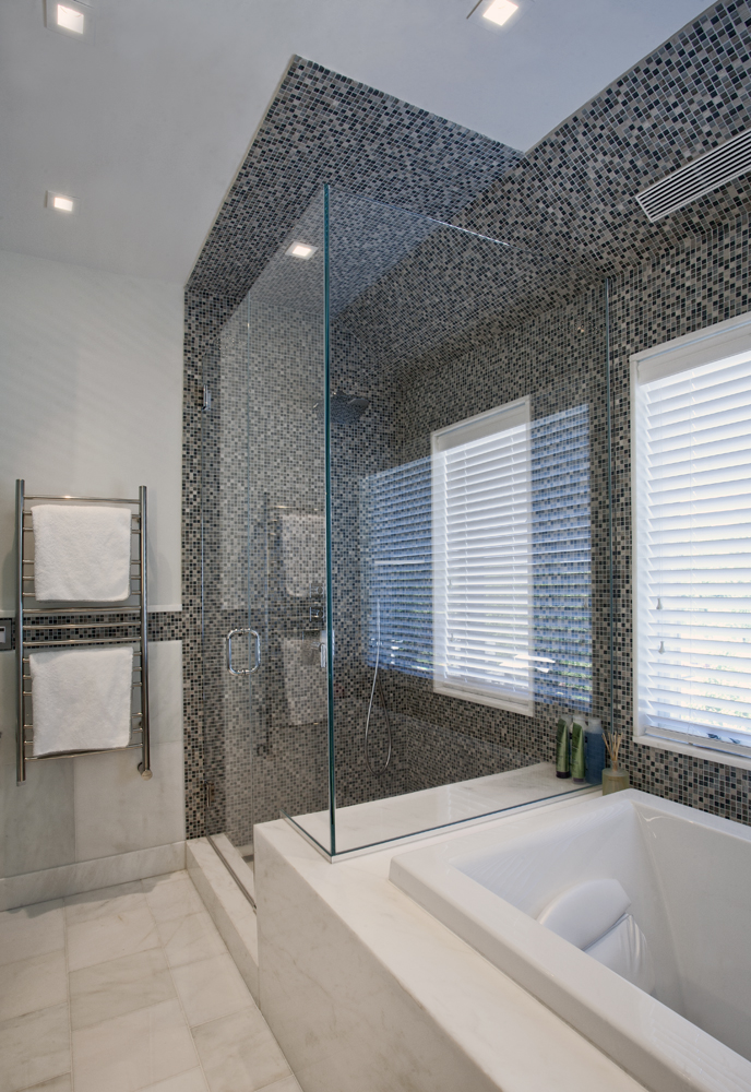 Shower with mosaic tile floor to ceiling
