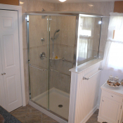 Glass shower with wainscot pony wall